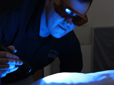 investigator with UV light