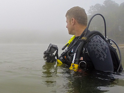 dive team officer in lake