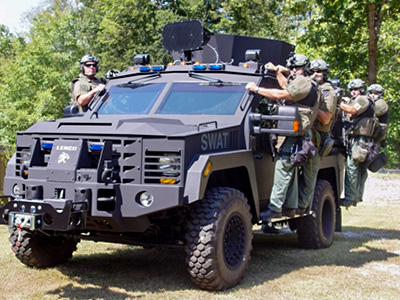 armored SWAT car and team